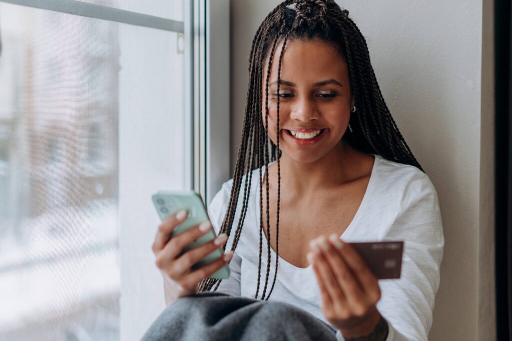 fintech representation showing a woman using her credit card conveniently.